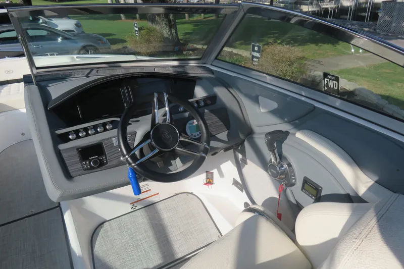 Slide: The Image of 2020 Cobalt R3 Surf boat cockpit with steering wheel and control panel. - 4