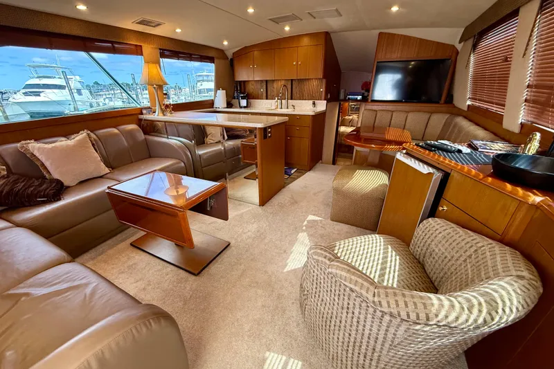 Slide: The Image of Luxurious interior of a 2000 Ocean Yachts 48, featuring elegant seating and modern amenities. - 1