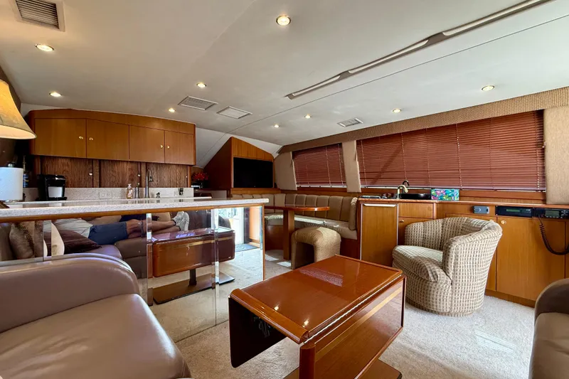 Slide: The Image of Luxurious interior of a 2000 Ocean Yachts 48, featuring elegant wood finishes and comfortable seating. - 21