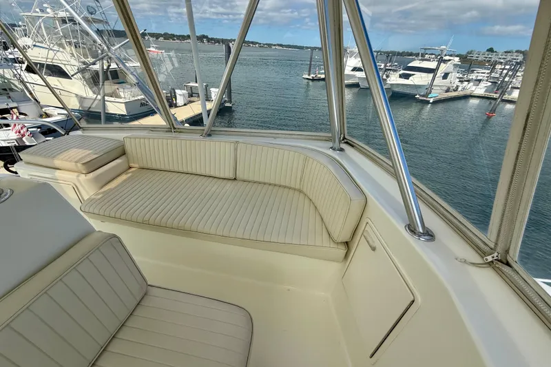 Slide: The Image of Luxurious seating area on a 2000 Ocean Yachts 48, overlooking a marina. - 22
