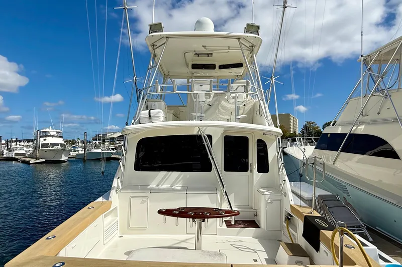 Slide: The Image of Ocean Yachts 48, 2000 model, docked at marina under blue sky. - 23