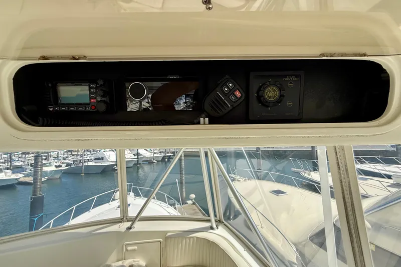 Slide: The Image of Control panel of a 2000 Ocean Yachts 48, featuring navigation and communication equipment. - 26