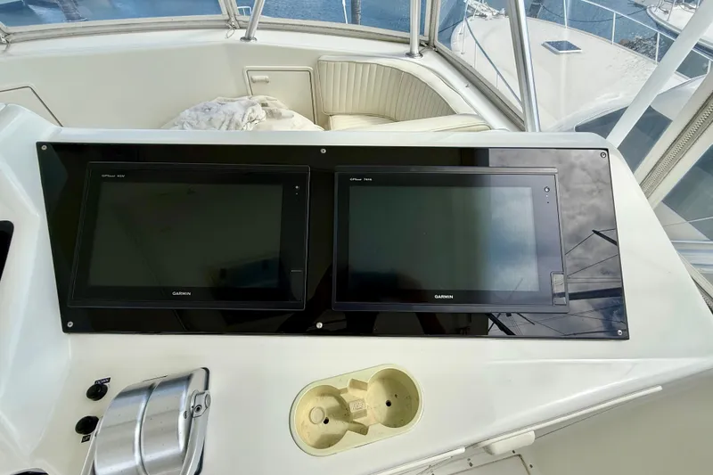 Slide: The Image of Control panel of a 2000 Ocean Yachts 48 with dual Garmin displays. - 30