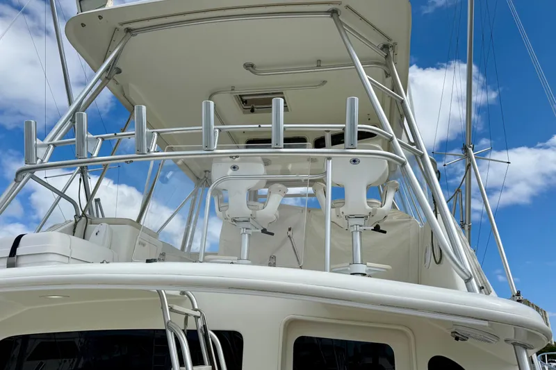 Slide: The Image of Ocean Yachts 48, 2000 model, featuring a flybridge with seating, under a clear blue sky. - 36