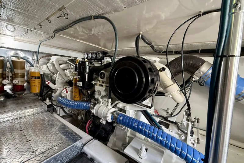 Slide: The Image of Engine room of a 2000 Ocean Yachts 48, featuring detailed mechanical components. - 4