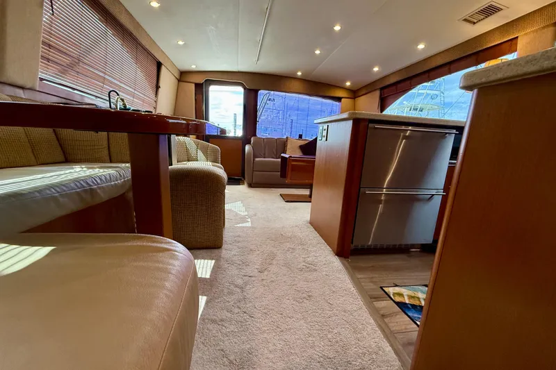 Slide: The Image of Luxurious interior of a 2000 Ocean Yachts 48, featuring modern furnishings and ambient lighting. - 9
