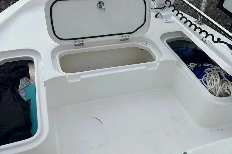 Slide: The Image of 2021 Shallow Sport 24 Modified V boat cruising on a scenic waterway. - 11