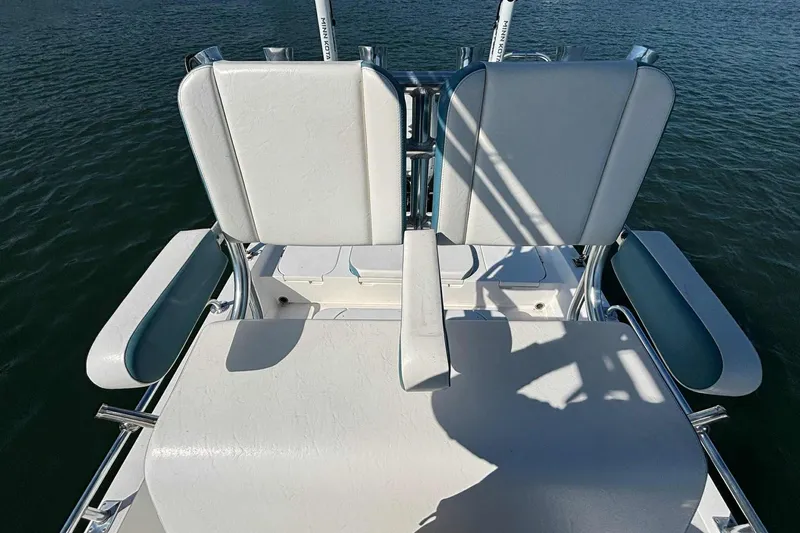 Slide: The Image of 2021 Shallow Sport 24 Modified V boat seats with water backdrop. - 25