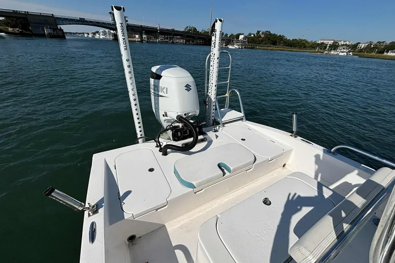 Slide: The Image of 2021 Shallow Sport 24 Modified V boat with Suzuki engine on calm water. - 26