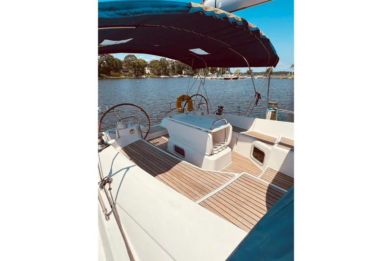 Slide: The Image of 2008 Jeanneau Sun Odyssey 45 DS sailboat with spacious deck and scenic water view. - 16