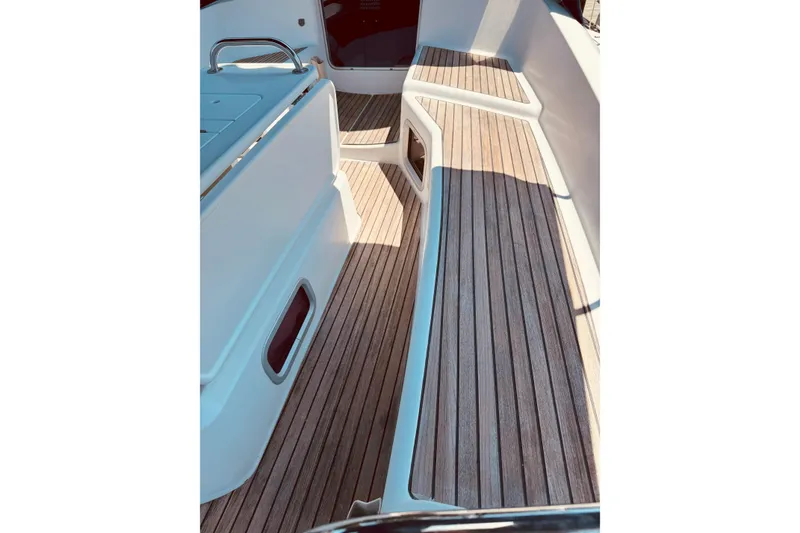 Slide: The Image of 2008 Jeanneau Sun Odyssey 45 DS deck with sleek wooden finish and modern design. - 19