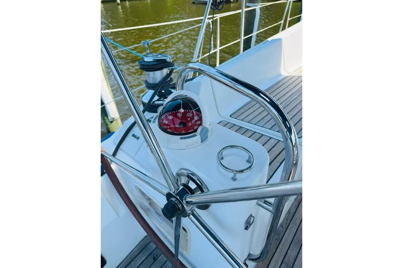 Slide: The Image of Steering wheel and compass on 2008 Jeanneau Sun Odyssey 45 DS sailboat. - 23