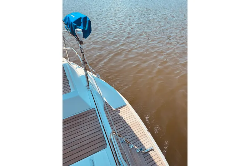 Slide: The Image of Jeanneau Sun Odyssey 45 DS sailboat deck, 2008 model, overlooking calm water. - 25