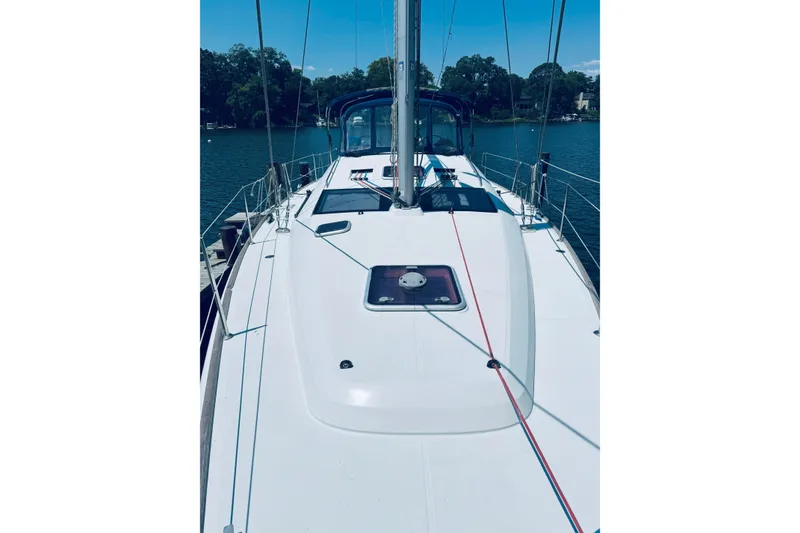 Slide: The Image of 2008 Jeanneau Sun Odyssey 45 DS sailboat deck with clear sky and water backdrop. - 27