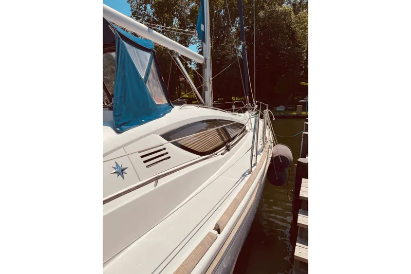 Slide: The Image of 2008 Jeanneau Sun Odyssey 45 DS sailboat docked, featuring sleek design and blue accents. - 31