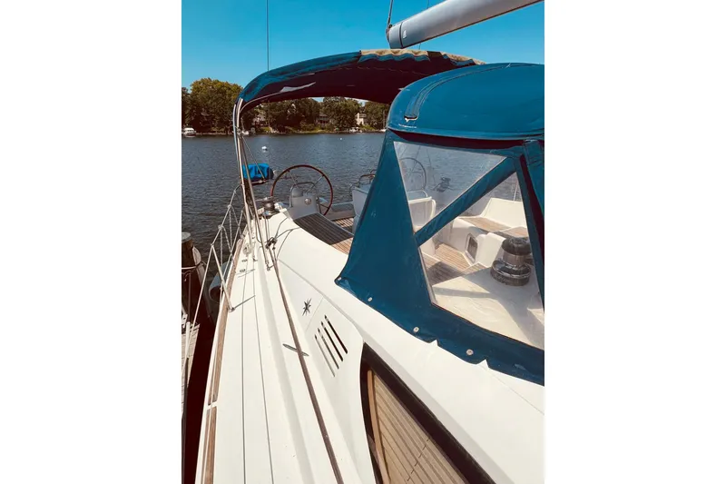 Slide: The Image of 2008 Jeanneau Sun Odyssey 45 DS sailboat with blue canopy on a sunny day. - 33