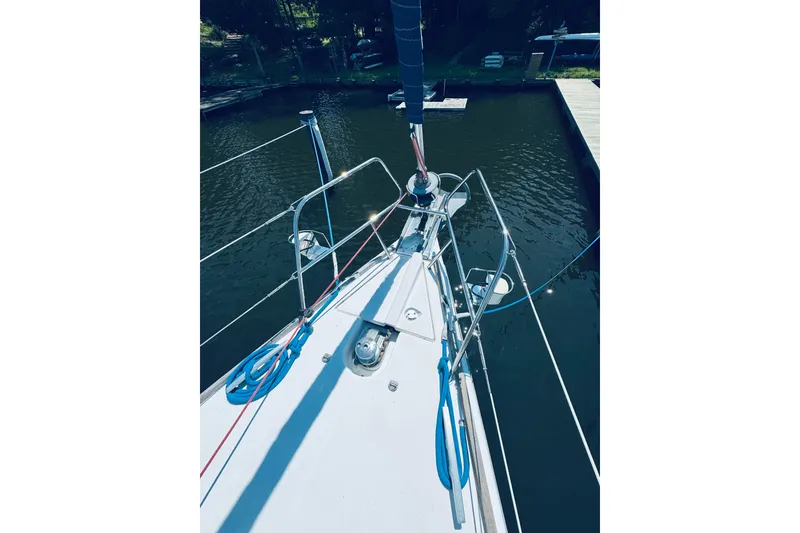 Slide: The Image of Bow view of 2008 Jeanneau Sun Odyssey 45 DS sailboat docked in calm waters. - 39