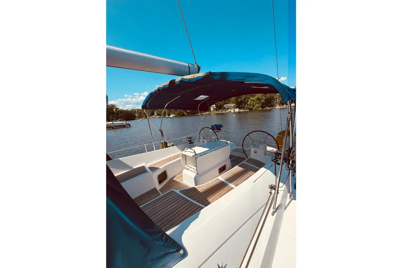 Slide: The Image of 2008 Jeanneau Sun Odyssey 45 DS sailboat cockpit with blue canopy on a sunny day. - 43