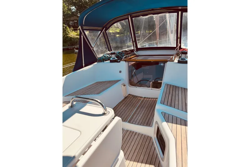 Slide: The Image of Cockpit of 2008 Jeanneau Sun Odyssey 45 DS sailboat with teak flooring and blue canopy. - 5