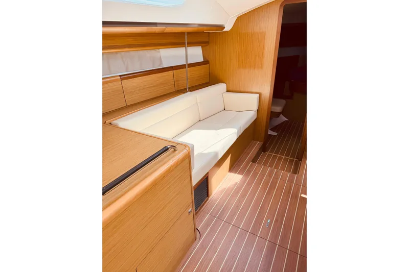 Slide: The Image of Interior of 2008 Jeanneau Sun Odyssey 45 DS yacht with wooden finish and white seating. - 50