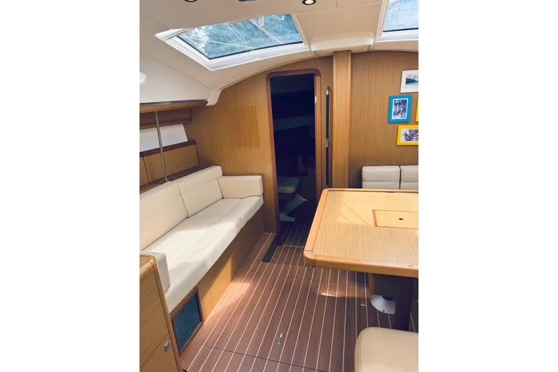 Slide: The Image of Interior of 2008 Jeanneau Sun Odyssey 45 DS yacht with elegant seating and wooden finishes. - 62