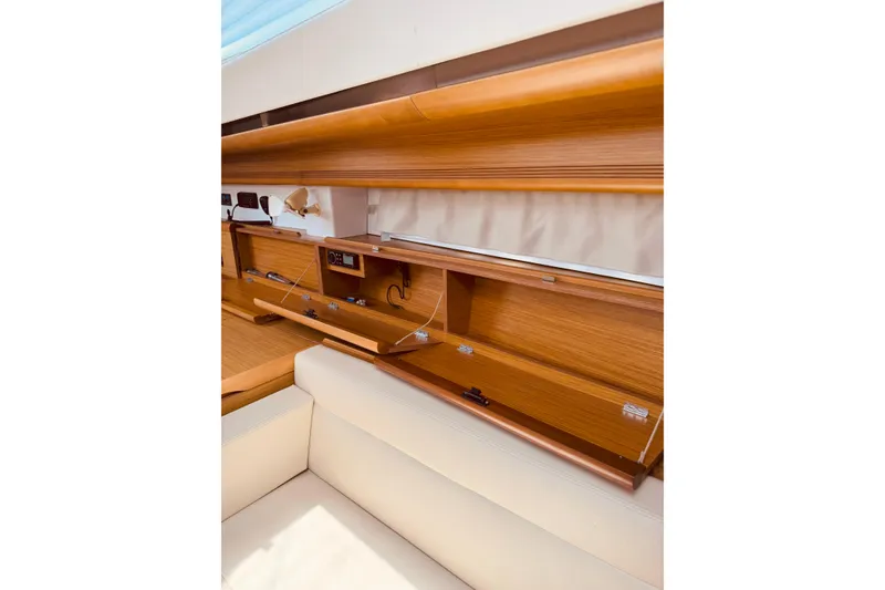 Slide: The Image of Interior of 2008 Jeanneau Sun Odyssey 45 DS, featuring wooden cabinetry and beige seating. - 66