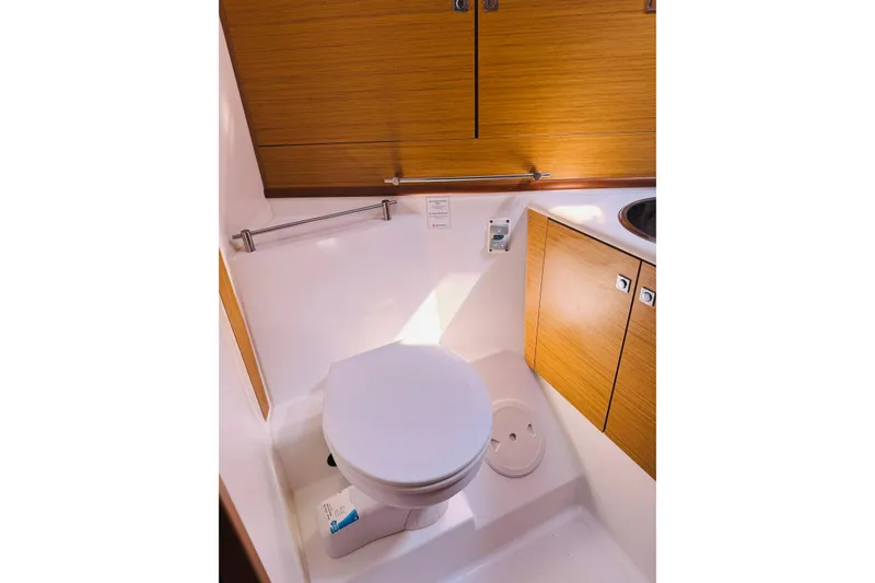 Slide: The Image of Bathroom interior of 2008 Jeanneau Sun Odyssey 45 DS yacht, featuring wooden cabinetry. - 71