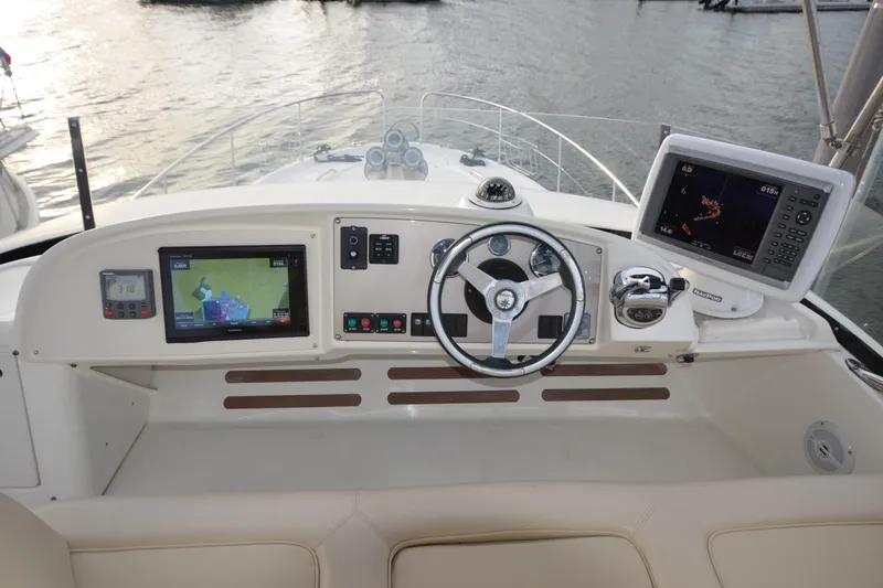 Slide: The Image of Helm of 2007 Jeanneau Prestige 46 yacht with navigation equipment and steering wheel. - 13