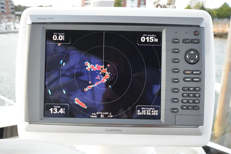Slide: The Image of Garmin GPS display on 2007 Jeanneau Prestige 46 yacht, showing navigation data and radar. - 14
