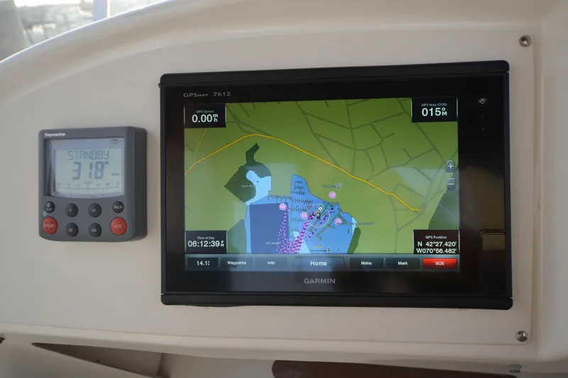 Slide: The Image of Garmin GPS and Raymarine display on 2007 Jeanneau Prestige 46 yacht dashboard. - 15
