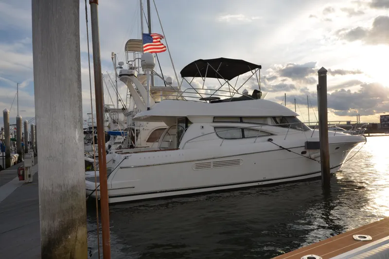 Slide: The Image of 2007 Jeanneau Prestige 46 yacht docked at marina during sunset. - 2