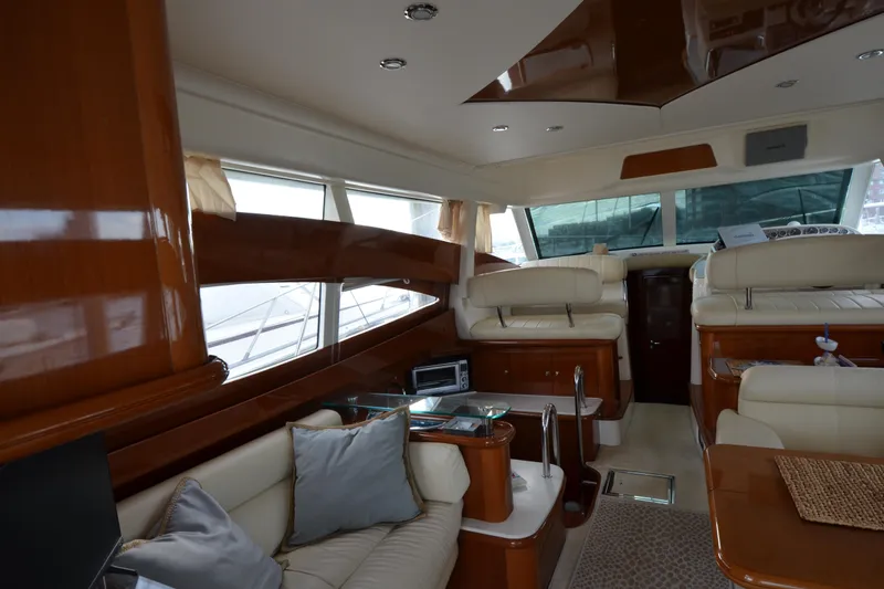 Slide: The Image of Luxurious interior of a 2007 Jeanneau Prestige 46 yacht with elegant seating and wood finishes. - 22