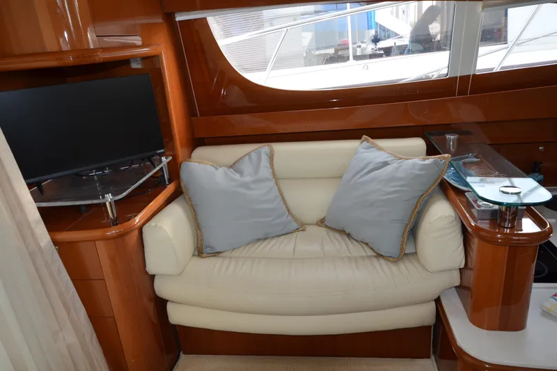 Slide: The Image of Luxurious interior of 2007 Jeanneau Prestige 46 yacht with cozy seating and modern TV. - 23