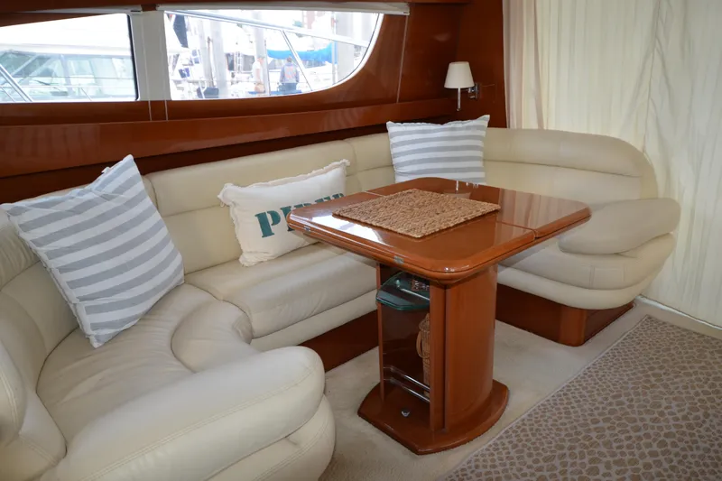 Slide: The Image of Luxurious interior of 2007 Jeanneau Prestige 46 yacht with elegant seating and table. - 24