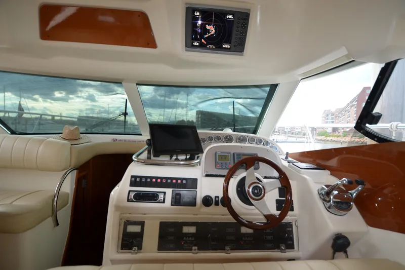 Slide: The Image of Interior helm of 2007 Jeanneau Prestige 46 yacht with steering wheel and navigation equipment. - 28