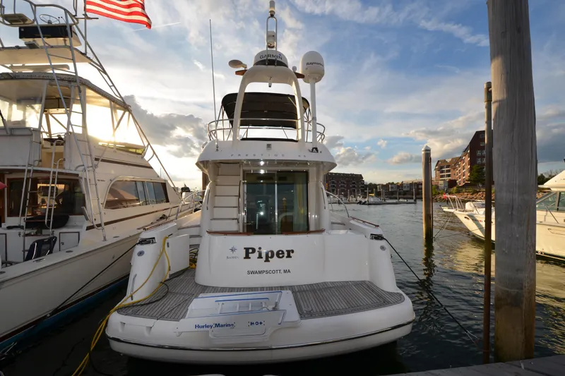 Slide: The Image of 2007 Jeanneau Prestige 46 yacht docked at marina, sunset view. - 3