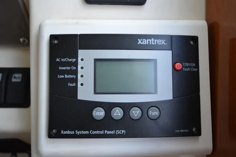 Slide: The Image of Xantrex control panel on 2007 Jeanneau Prestige 46 yacht, displaying system status indicators. - 33