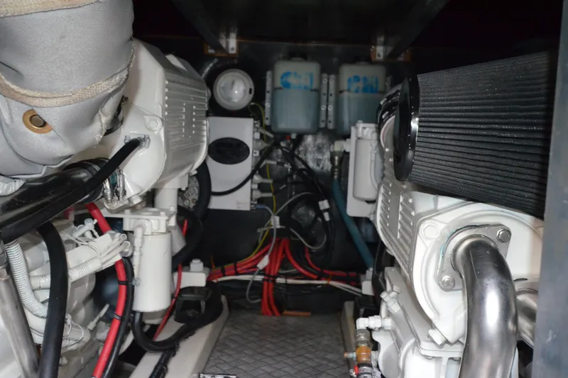 Slide: The Image of Engine room of 2007 Jeanneau Prestige 46 yacht, showcasing mechanical components and wiring. - 51