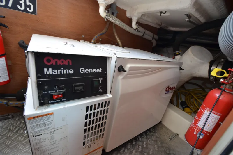 Slide: The Image of Onan Marine Genset in 2007 Jeanneau Prestige 46 engine room with fire extinguisher. - 52