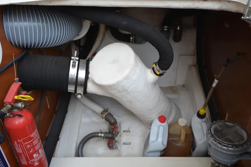 Slide: The Image of Engine compartment of 2007 Jeanneau Prestige 46 yacht with hoses and fire extinguisher. - 57