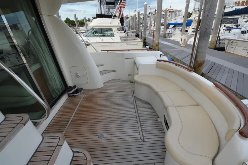 Slide: The Image of Luxurious Jeanneau Prestige 46 yacht deck with seating, docked at marina, 2007 model. - 8