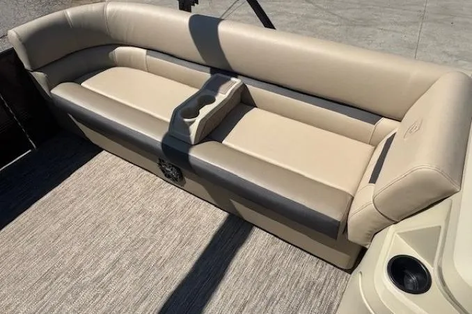 Slide: The Image of 2024 Godfrey SWEETWATER 2286 SFL boat seating with beige upholstery and cup holders. - 12