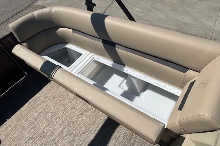 Slide: The Image of 2024 Godfrey SWEETWATER 2286 SFL boat seating with storage compartment, beige upholstery. - 13