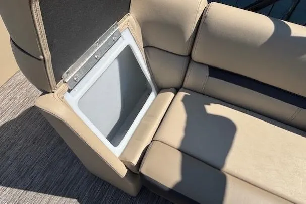 Slide: The Image of 2024 Godfrey SWEETWATER 2286 SFL boat seat with storage compartment open. - 16