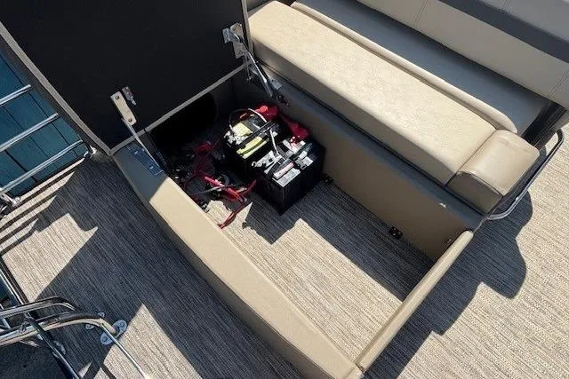 Slide: The Image of 2024 Godfrey SWEETWATER 2286 SFL boat storage compartment with battery and wiring. - 30