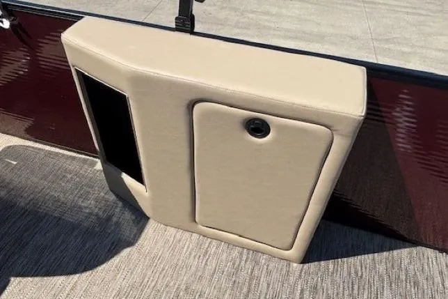 Slide: The Image of 2024 Godfrey SWEETWATER 2286 SFL boat interior with beige panel and storage compartment. - 32