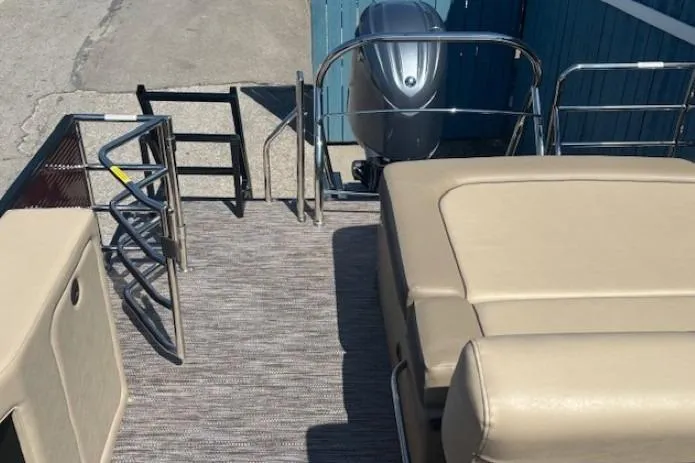 Slide: The Image of 2024 Godfrey SWEETWATER 2286 SFL pontoon boat with beige seating and outboard motor. - 35