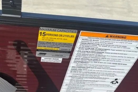 Slide: The Image of 2024 Godfrey SWEETWATER 2286 SFL capacity label, 15 persons or 2110 lbs, safety warnings. - 36