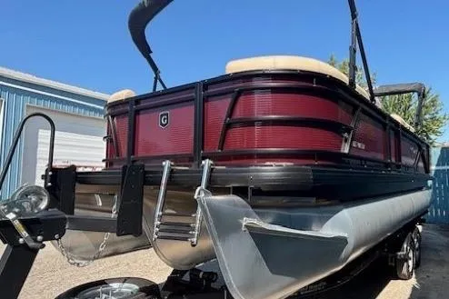 Slide: The Image of 2024 Godfrey SWEETWATER 2286 SFL pontoon boat with red exterior and black accents. - 4
