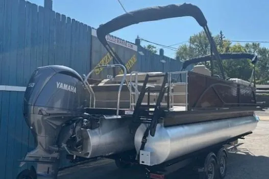 Slide: The Image of 2024 Godfrey SWEETWATER 2286 SFL pontoon boat with Yamaha engine, parked outdoors. - 7